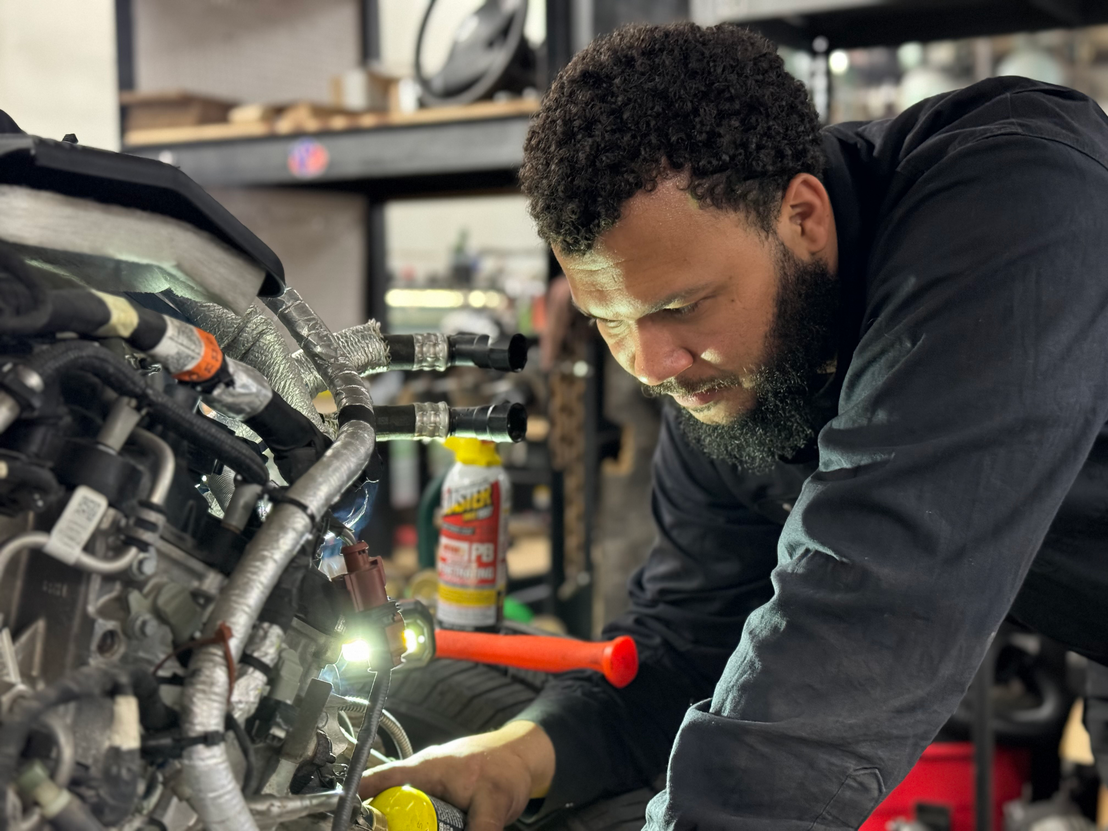close up JRB employee working on engine